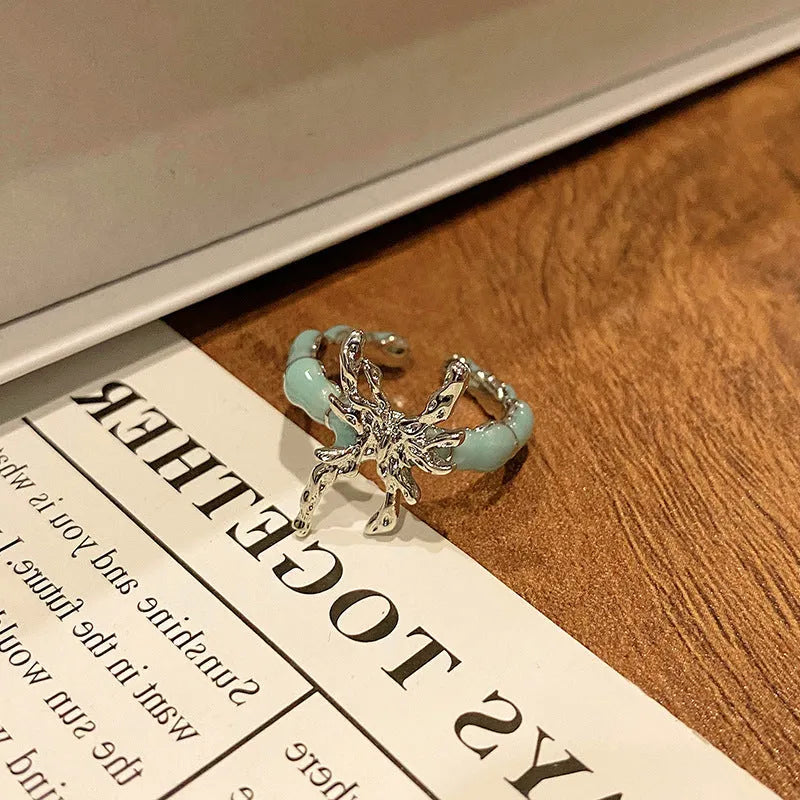 Butterfly design copper ring with oil-drip textured finish in women's jewellery