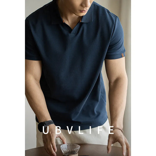 Blue cotton polyester blend short-sleeved polo shirt on a hanger, showing regular fit and casual style.