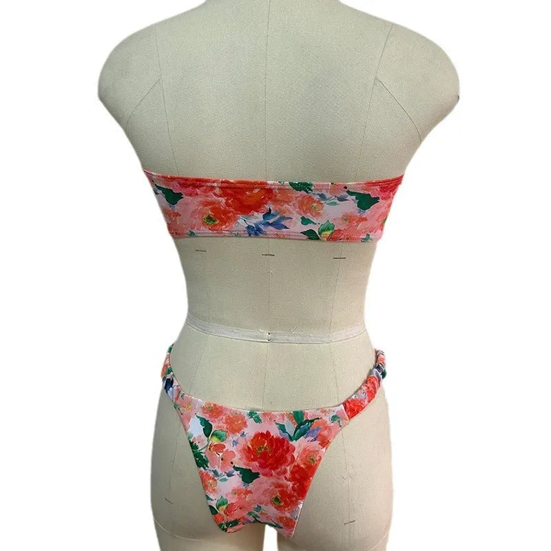 Blue floral print tube top bikini set with lace trim on a mannequin.