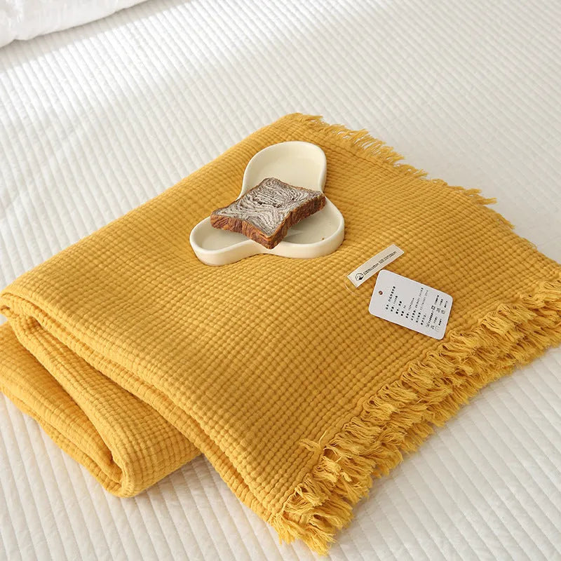 Four-layer gauze cotton blanket with tassel detailing in avocado green colour