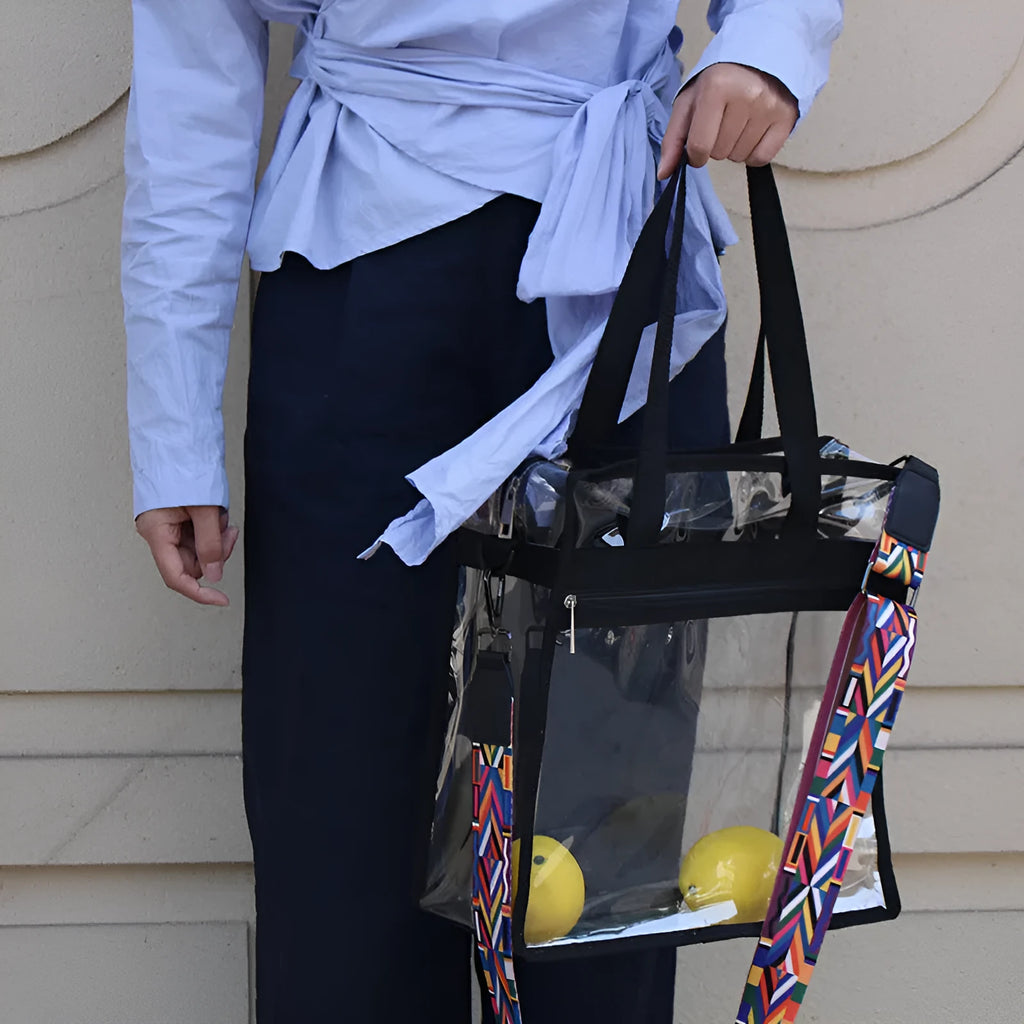 Women's transparent PVC crossbody messenger bag showing front 3D pocket and double shoulder straps.