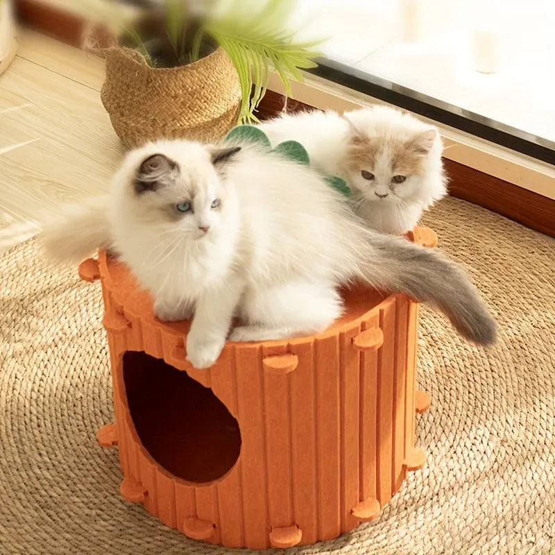 Orange carrot-shaped cat tunnel bed made of felt, showing its semi-enclosed design and entrance.