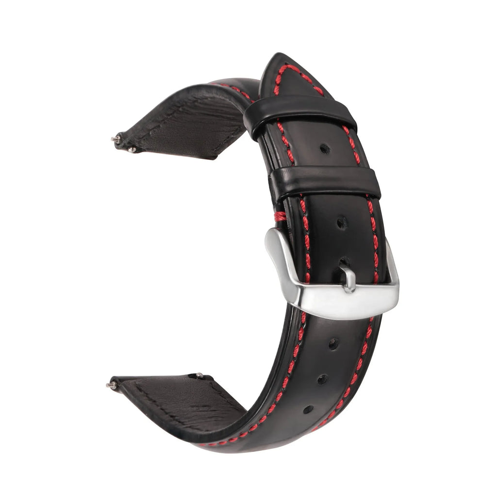 Quick release cowhide leather watch strap in black and white line colour on a watch.