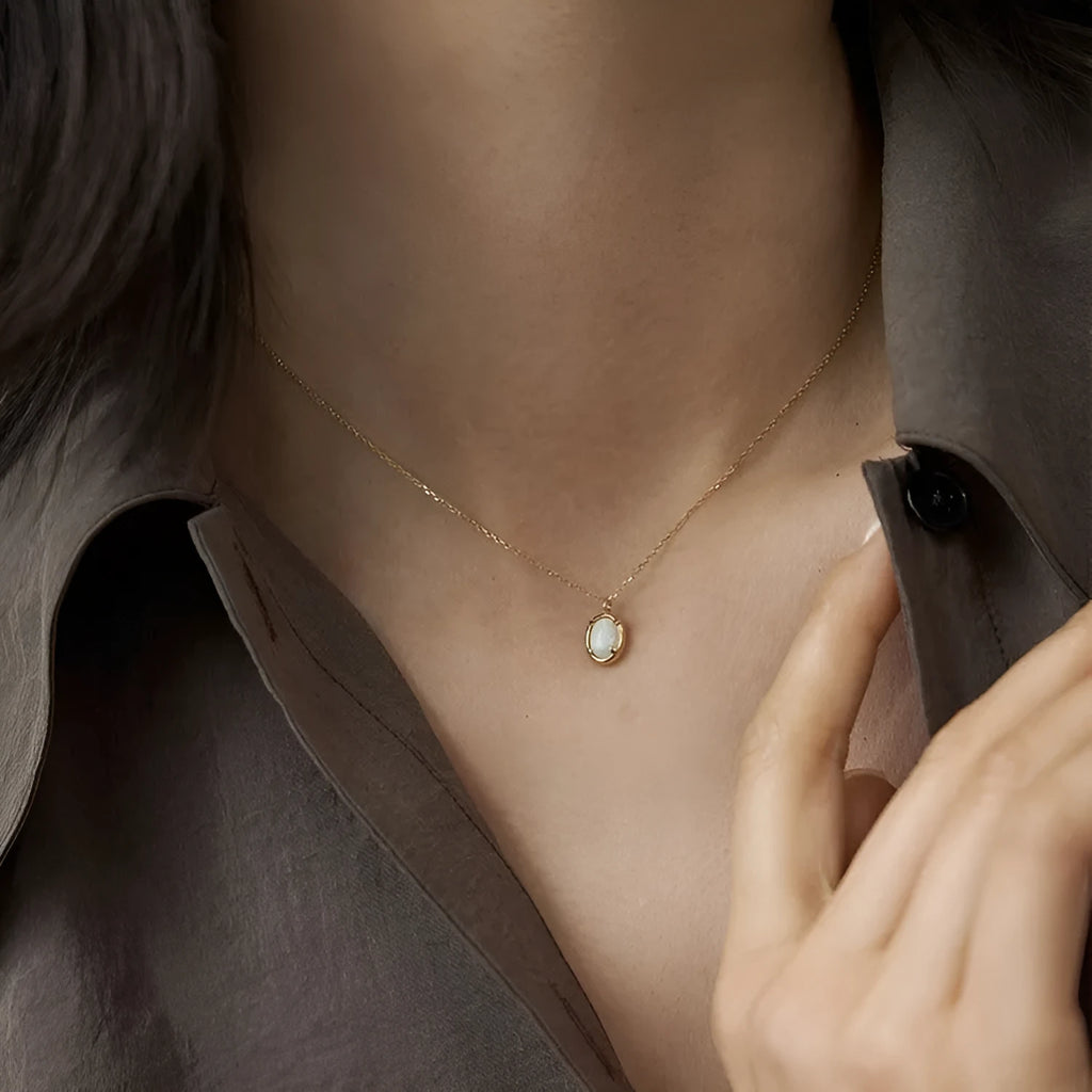Geometric jelly opal pendant on a chain, made from 925 silver with gold or white gold plating.