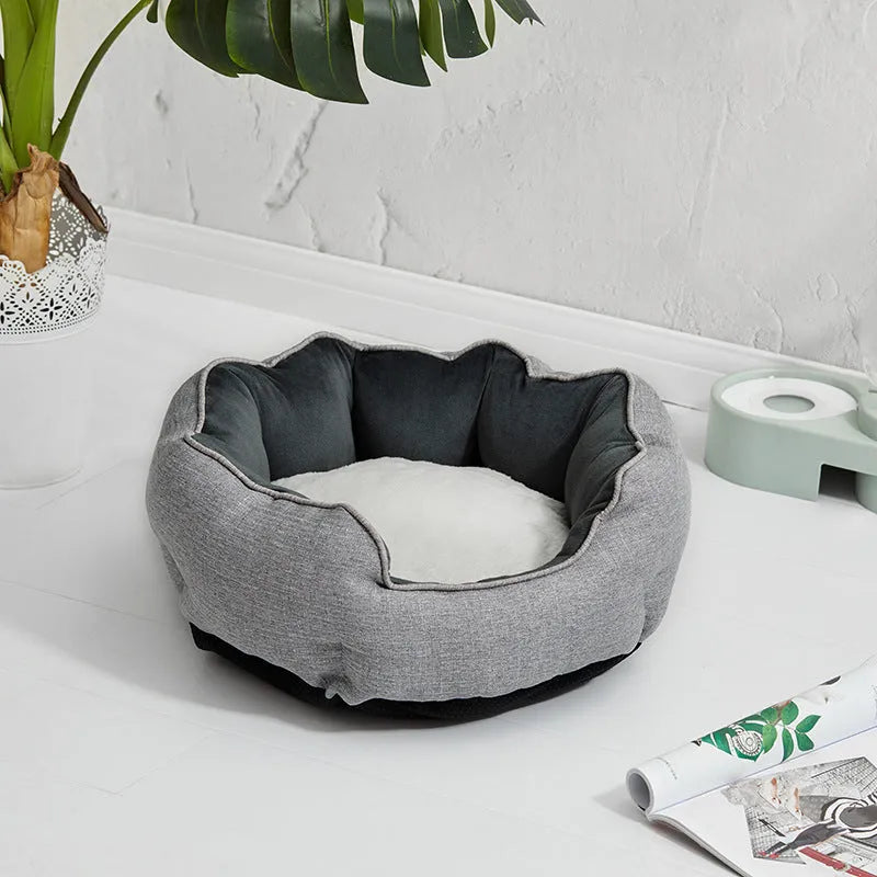 Blue octagonal pet sofa bed with a removable central mat for a small dog or cat.