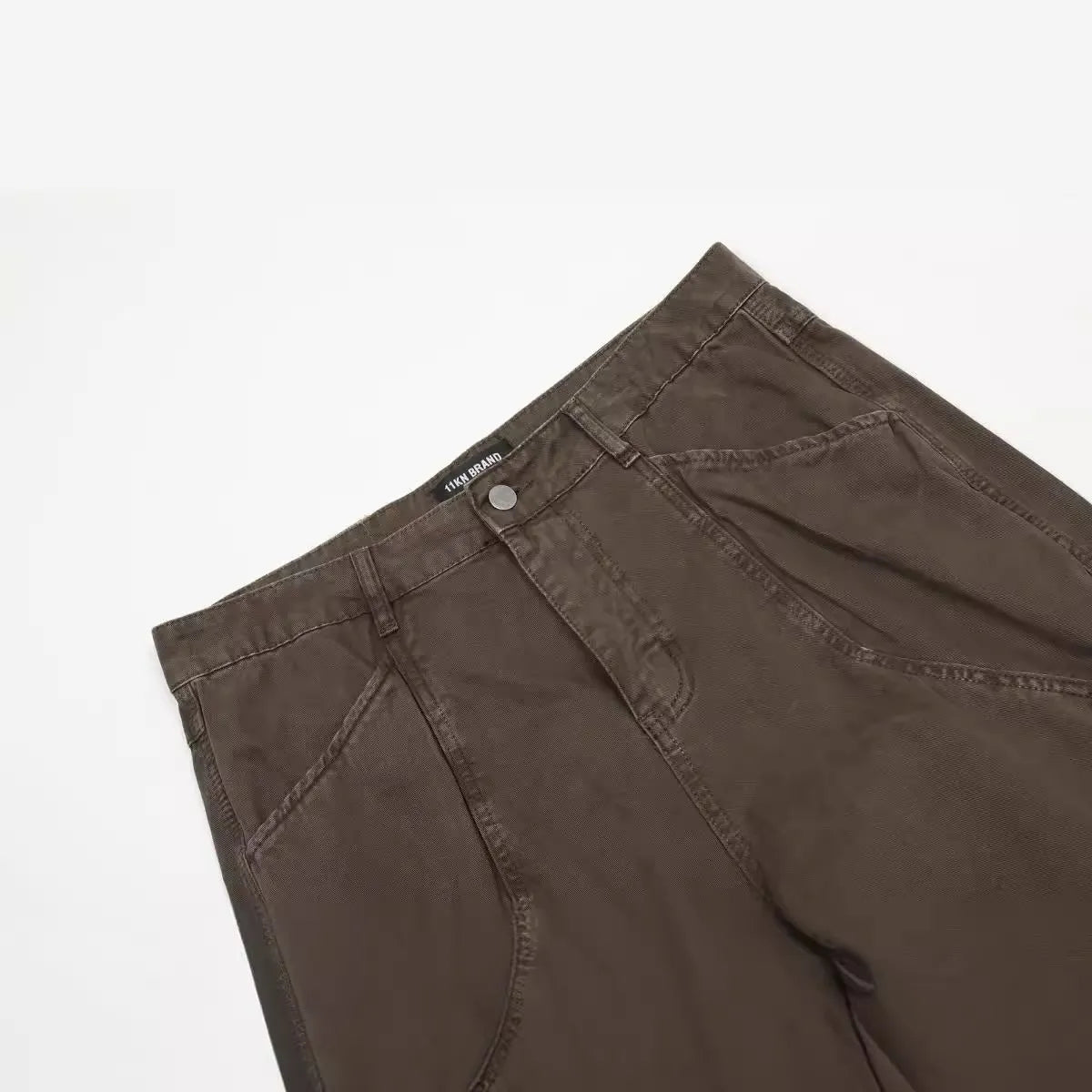Men's brown loose fit straight leg trousers with high waist and zipper fly opening