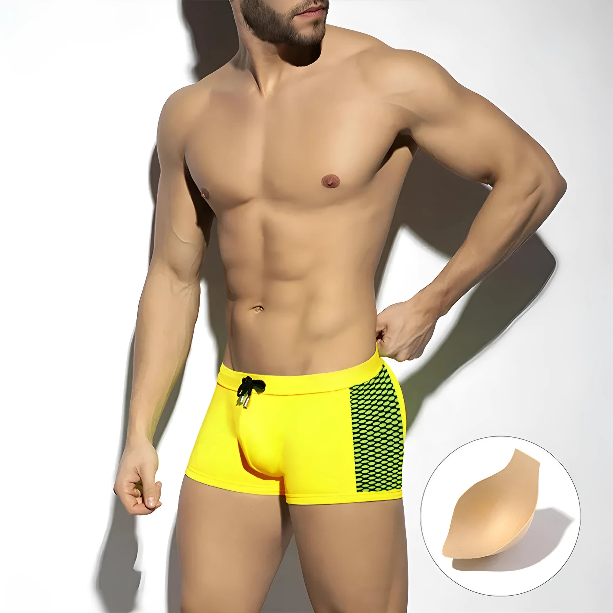 Men's polka dot print quick-drying swimming boxers in nylon fabric on a size chart.