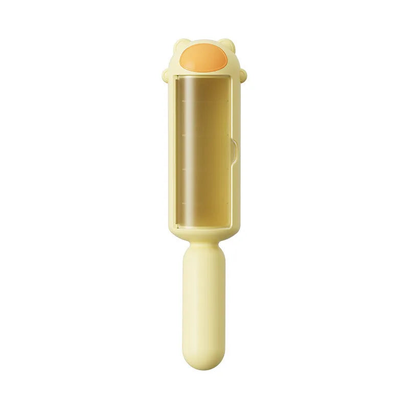Blue reusable pet hair remover roller for furniture and car seats on a grey sofa