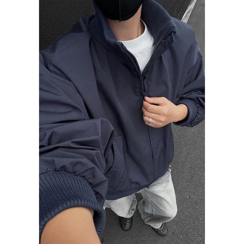 Men's cleanfit short jacket in solid colour polyester with side seam pockets, black colour option