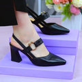 Women's black closed toe leather sandals with a chunky block heel and strapless slip-on design.