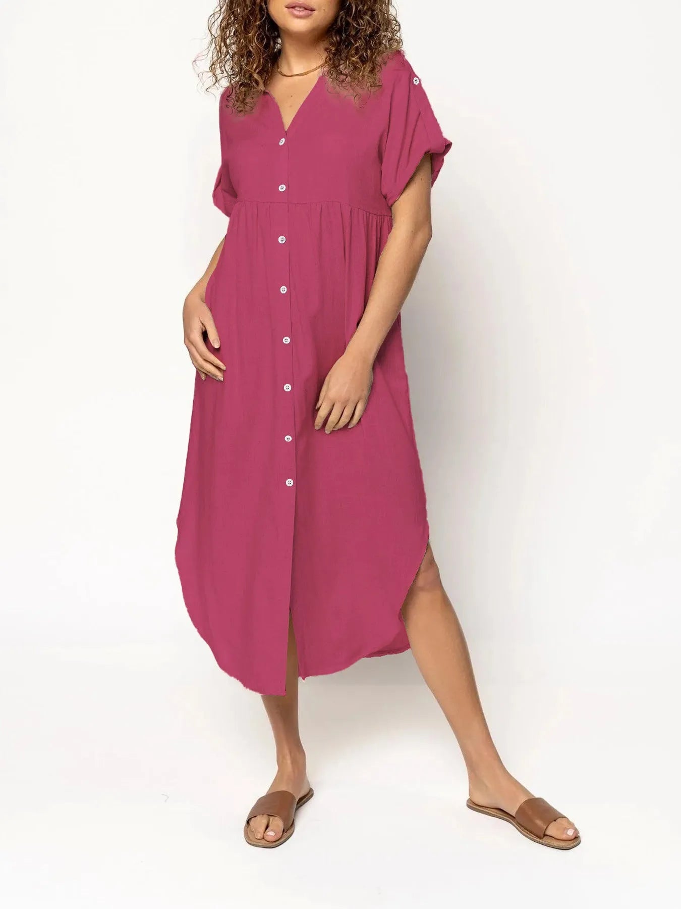 A mid-length casual dress with button detail on the front, shown in a solid colour.