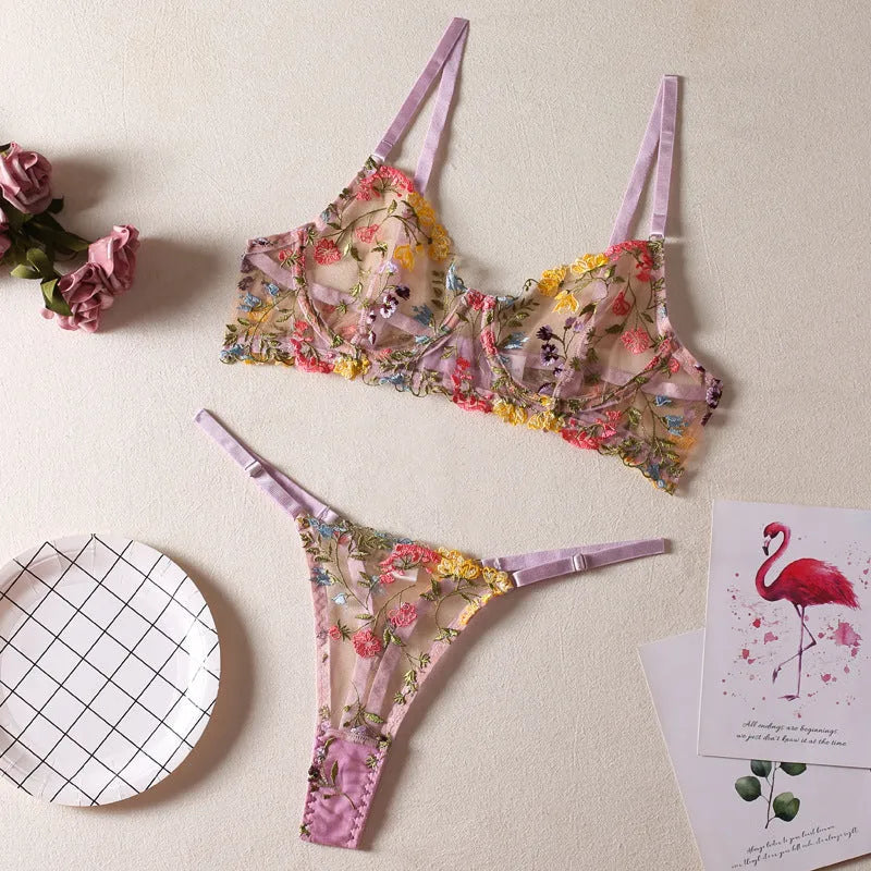 Floral patterned mesh bra with steel ring detail on T-back strap, shown in skin colour.