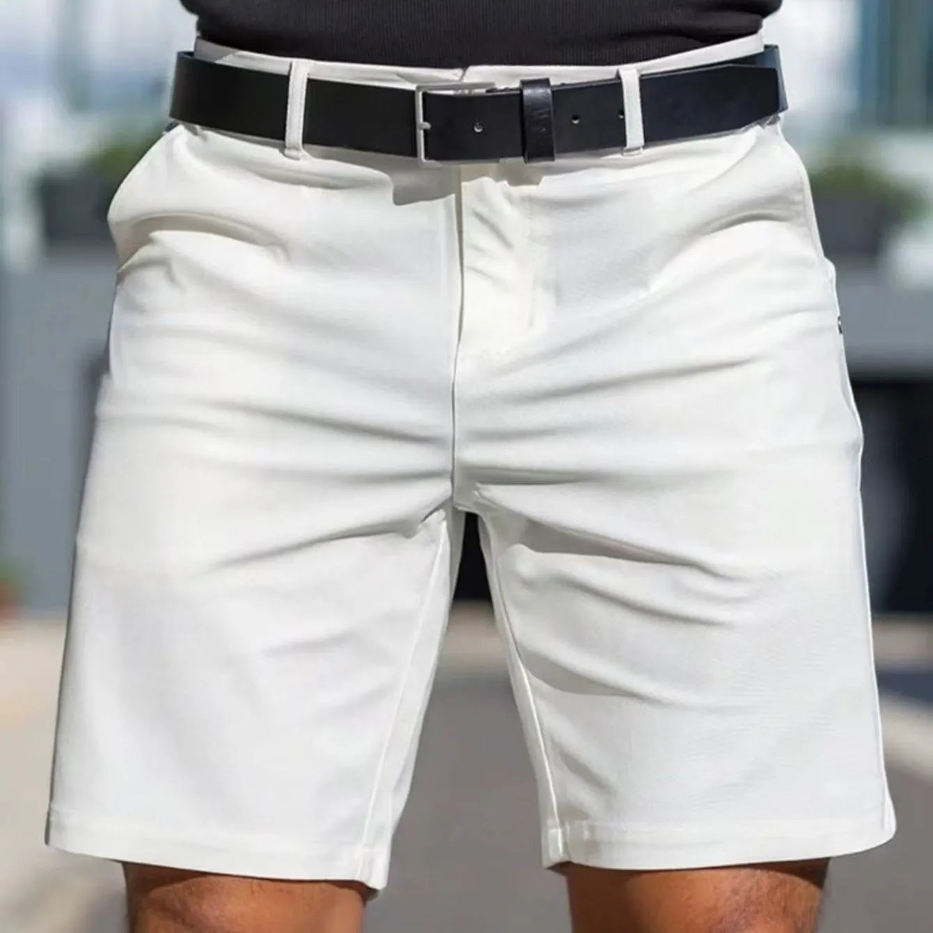Men's solid colour straight-leg polyester shorts with micro elasticity, shown in apricot.
