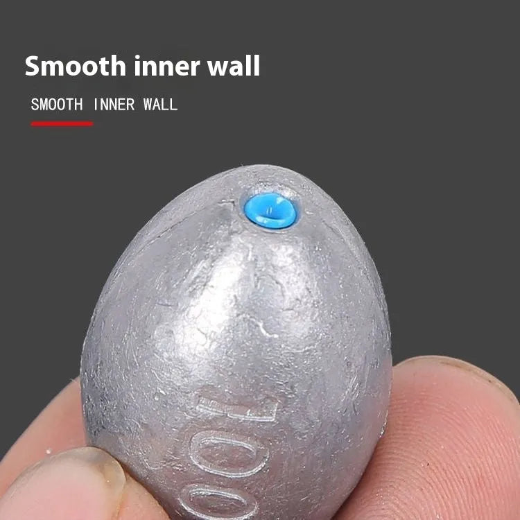 Olive lead fishing sinker with plastic core, rugby shape, and scale pattern in weights from 10g to 150g