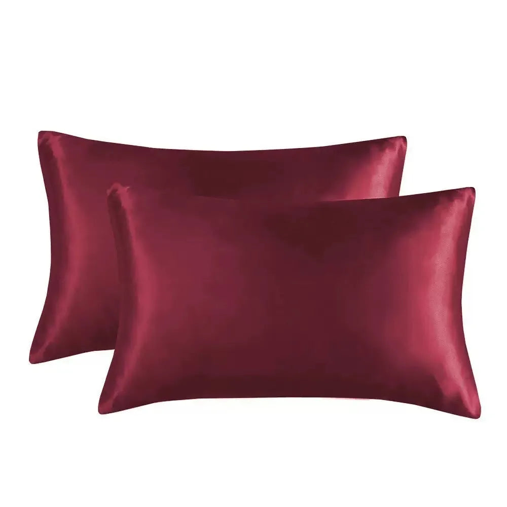 Pair of solid colour satin cloth pillowcases in polyester fibre available in twelve colours and four sizes