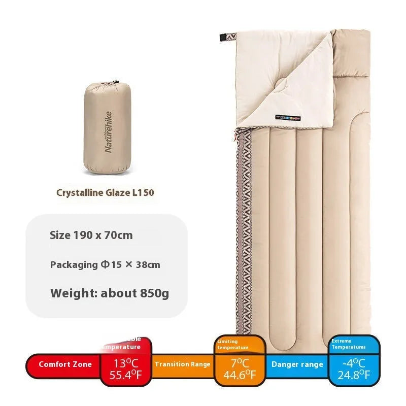 Four seasons camping sleeping bag in swamp colour, shown with its storage bag.