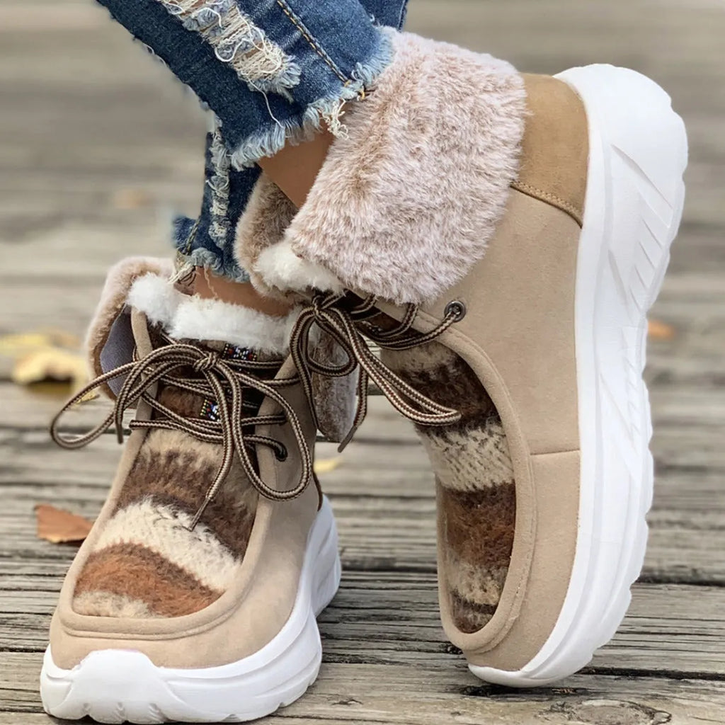Women's beige lace-up suede snow boots with thermal lining and a thick rubber sole.
