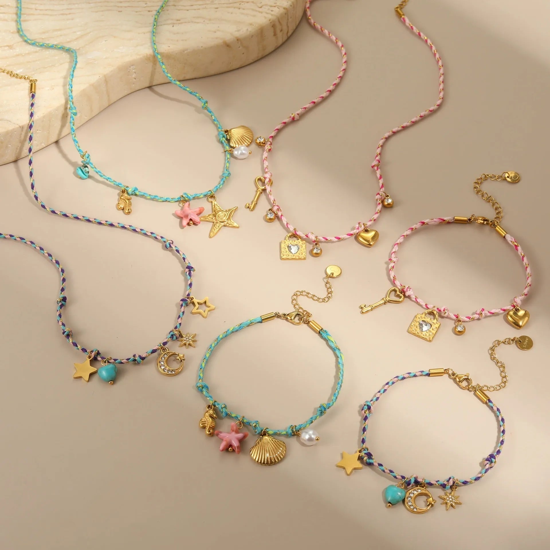 Handmade purple, pink, or blue braided rope and steel necklace or bracelet with heart, star, or geometric pendant.