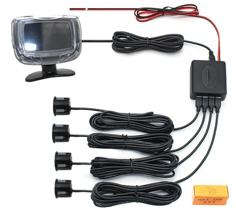 Black wireless reversing sensor kit with digital display, four round probes, power cable, and installation tools.
