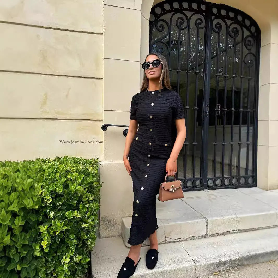 Black retro slim fit knitted long-sleeved dress with button detailing and a mid waist.