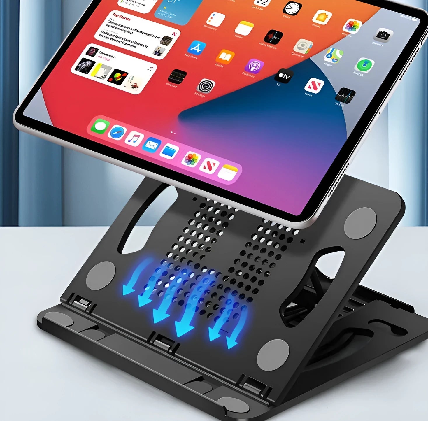 Adjustable ABS laptop and tablet cooling stand in black on a desktop