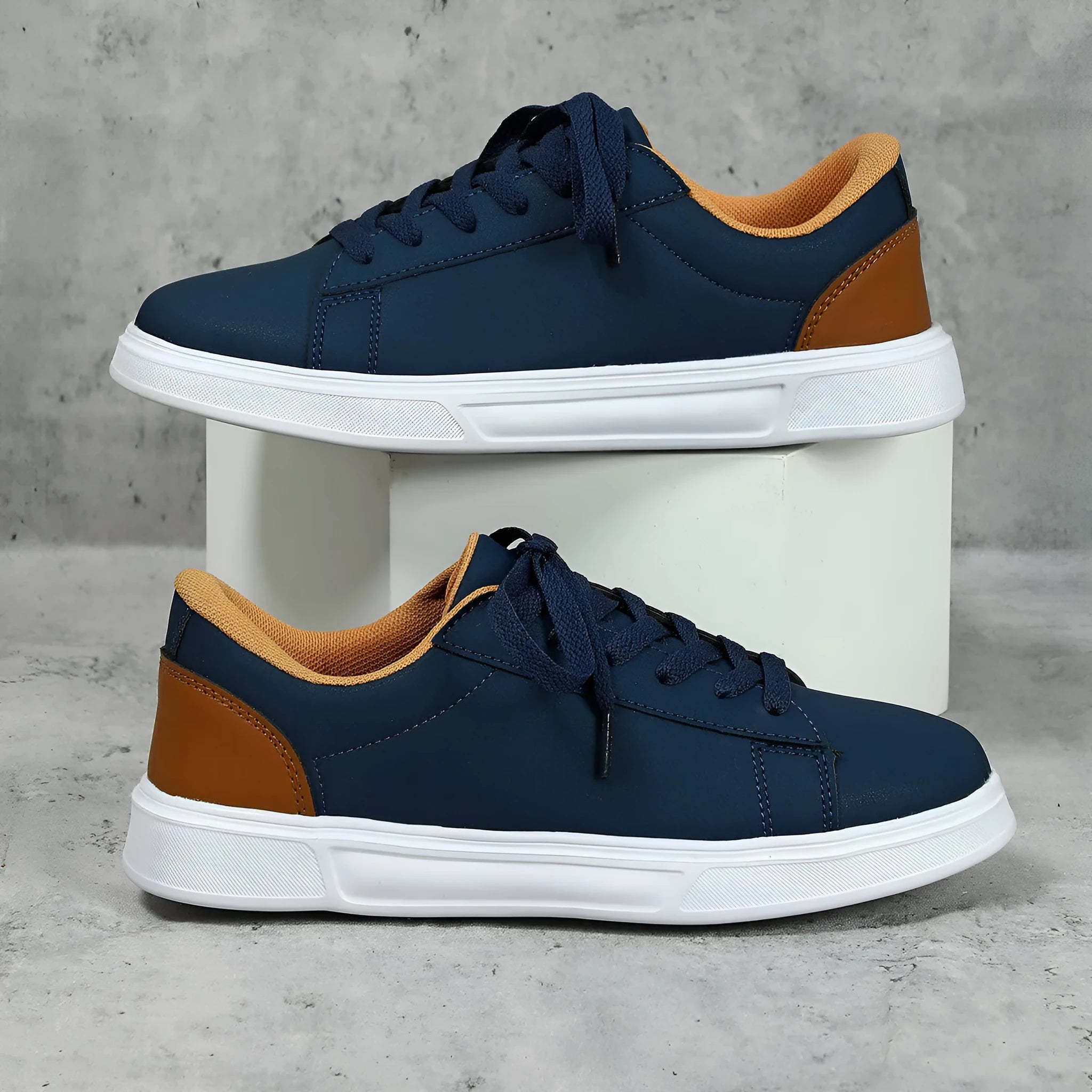 Beige brown platform skateboard sneaker with low top, round toe, and cross-belt design on a white background.
