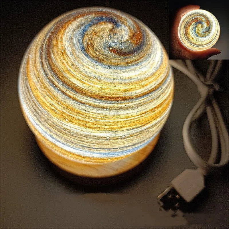 Compact modern planet USB night light on its base with dimmable three-colour lighting.