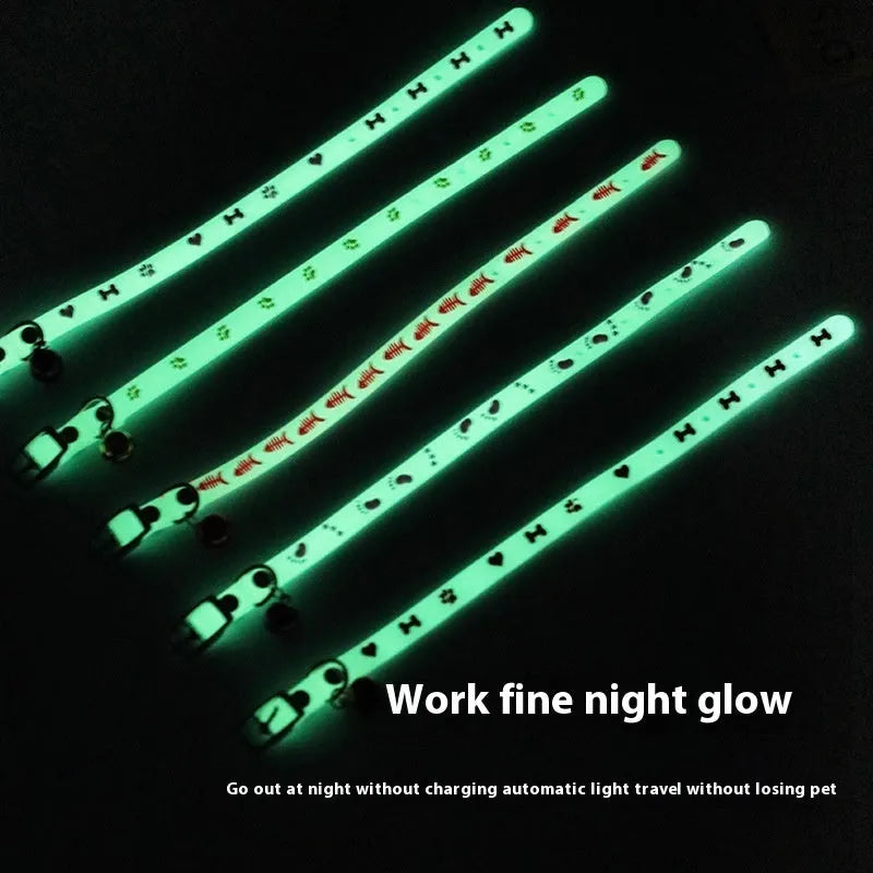 Glow in the dark cat collar with adjustable silicone chain and metal bell in paw print design