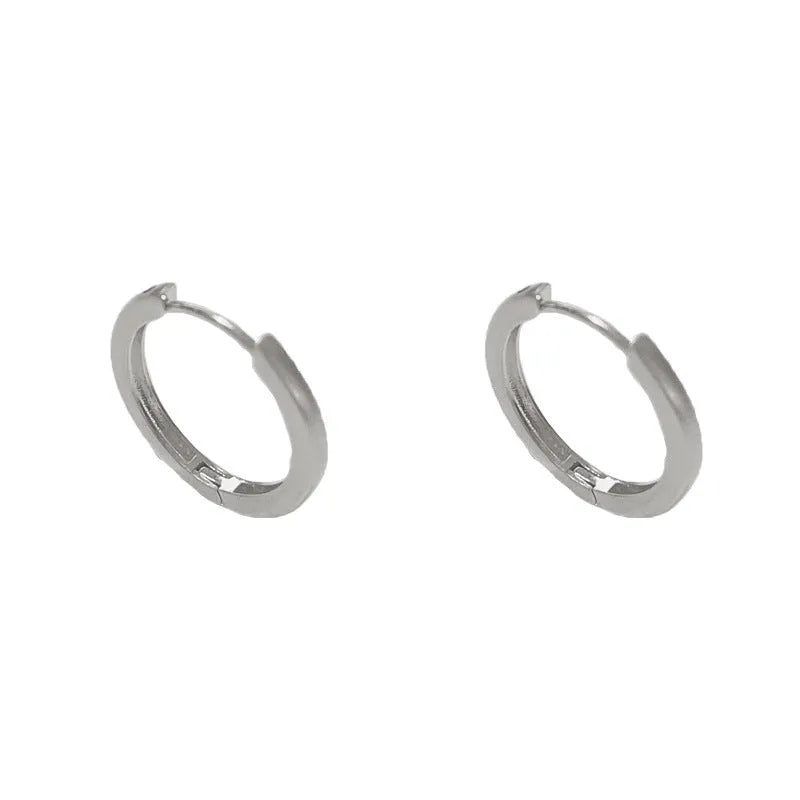 Geometric gold or silver-plated ear clip with round eyelet detail for women