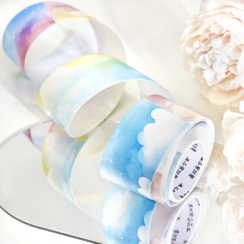 Roll of Japanese paper washi tape with sky theme designs showing colourful cloud pattern