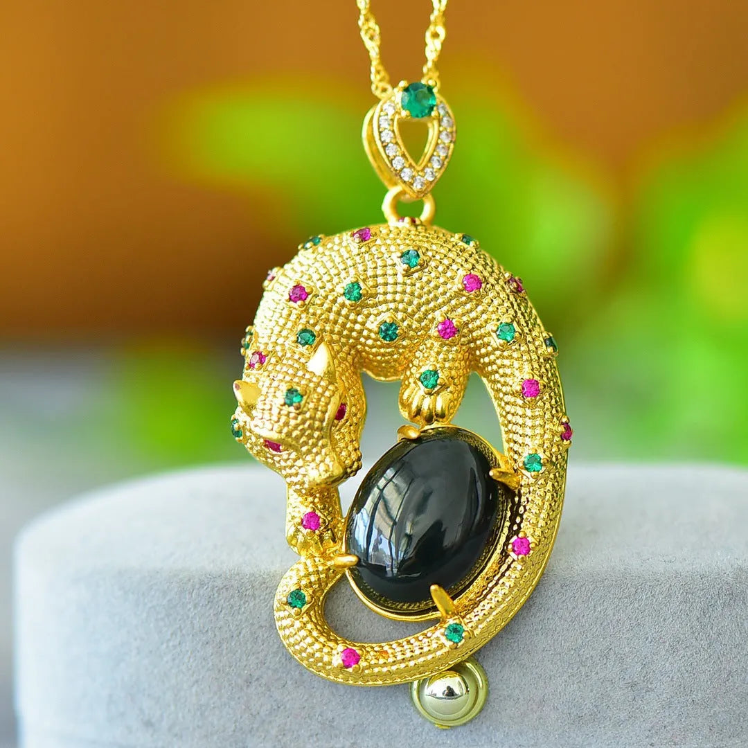 Flat gray and ink blue Hetian Jade pendant with copper inlaid decoration on a necklace.