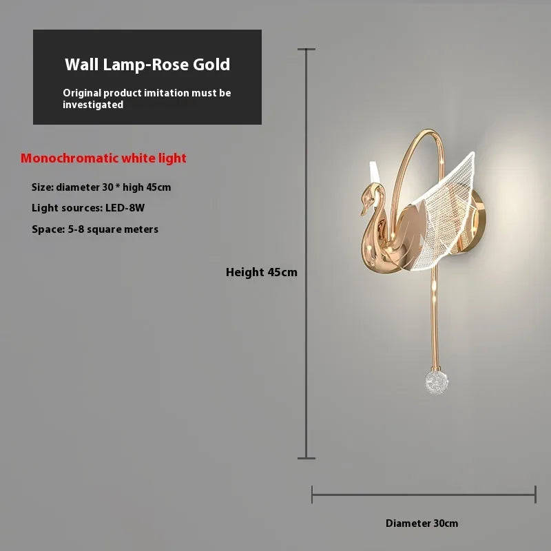 Gold swan design wall lamp with acrylic shade showing LED lighting and iron construction