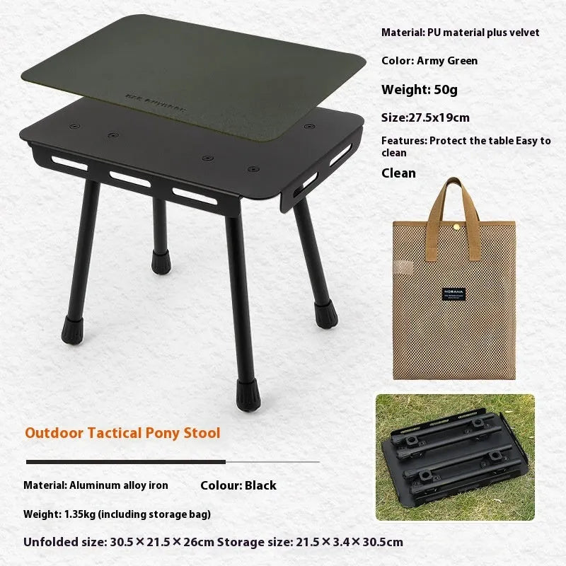 Aluminium folding camping stool that converts into a small table, shown with a tactical storage bag and a beige PU cushion.