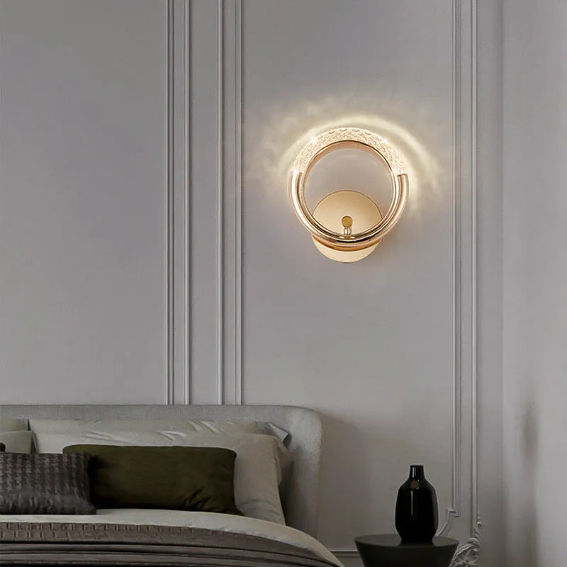 Minimalist modern wall lamp with a white acrylic shade, shown mounted on a wall.