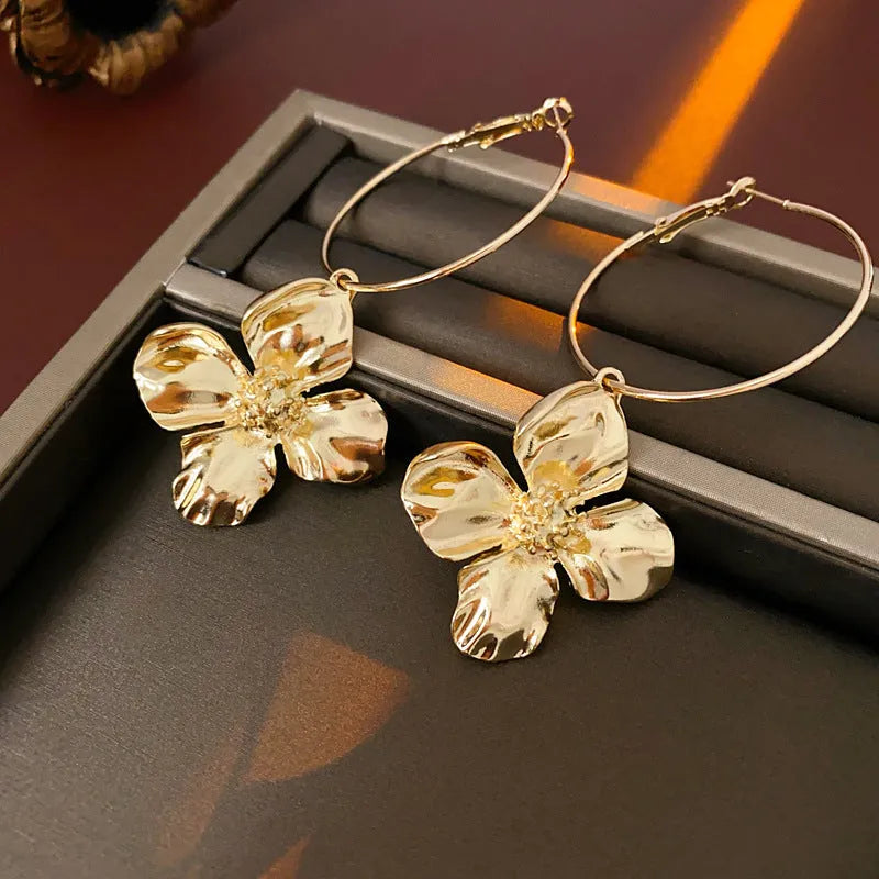 Metal flower geometric earrings with silver needle detail in gold or silver electroplated finish