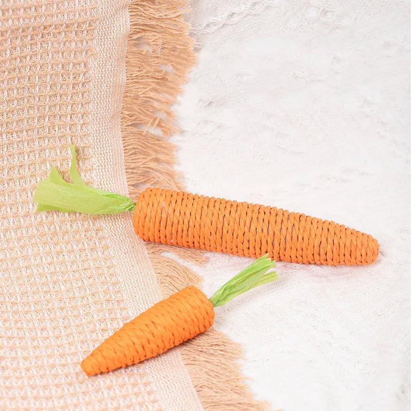 Multipack of cat toys including paper carrots, jingling stones, cat sticks, and tooth grinding sticks in two size options