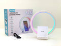White square Bluetooth speaker with integrated wireless charging pad and ambient LED lighting.