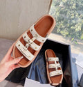 Women's retro Roman style sandal slippers in patent leather, shown in black, white, and brown colour options.