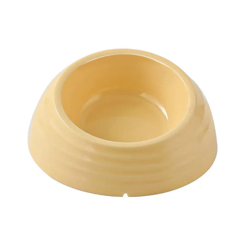 Stainless steel cat bowl with plastic base in beige, brown, or light green.