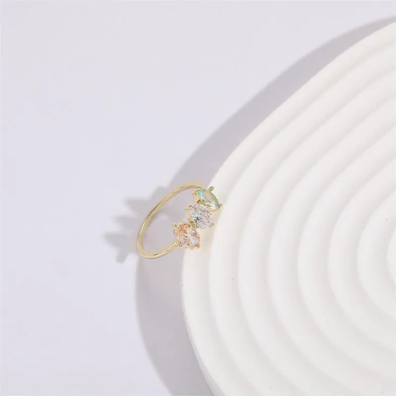 Geometric triangle birthstone ring with horse eye tricolor zircon stones in gold finish
