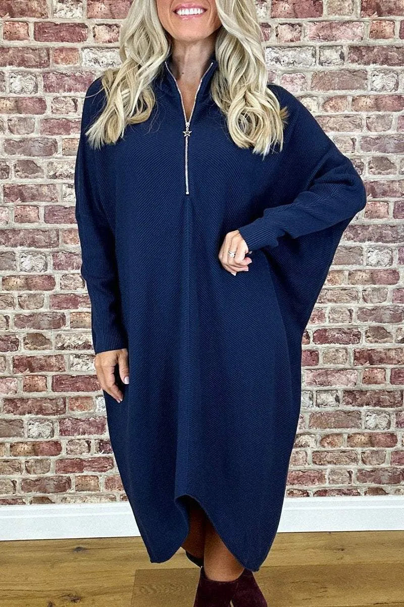 Women's solid colour loose fit knit dress with raglan sleeves on a hanger.