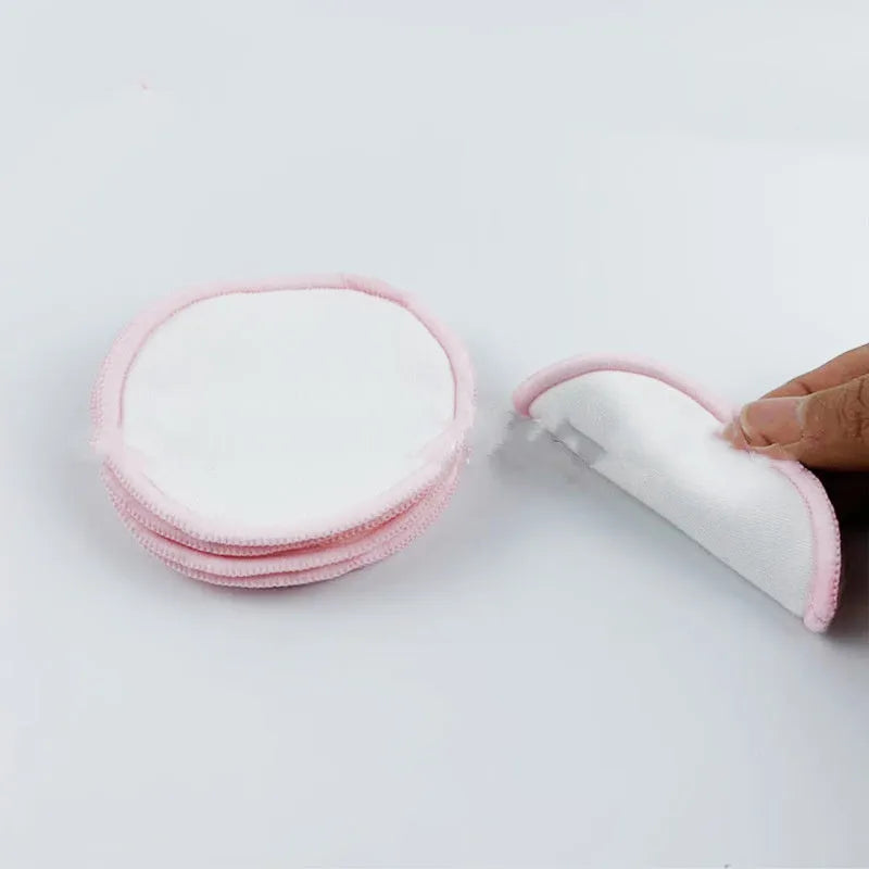 Set of velvet makeup remover pads in red and blue colours with cotton mesh storage bag