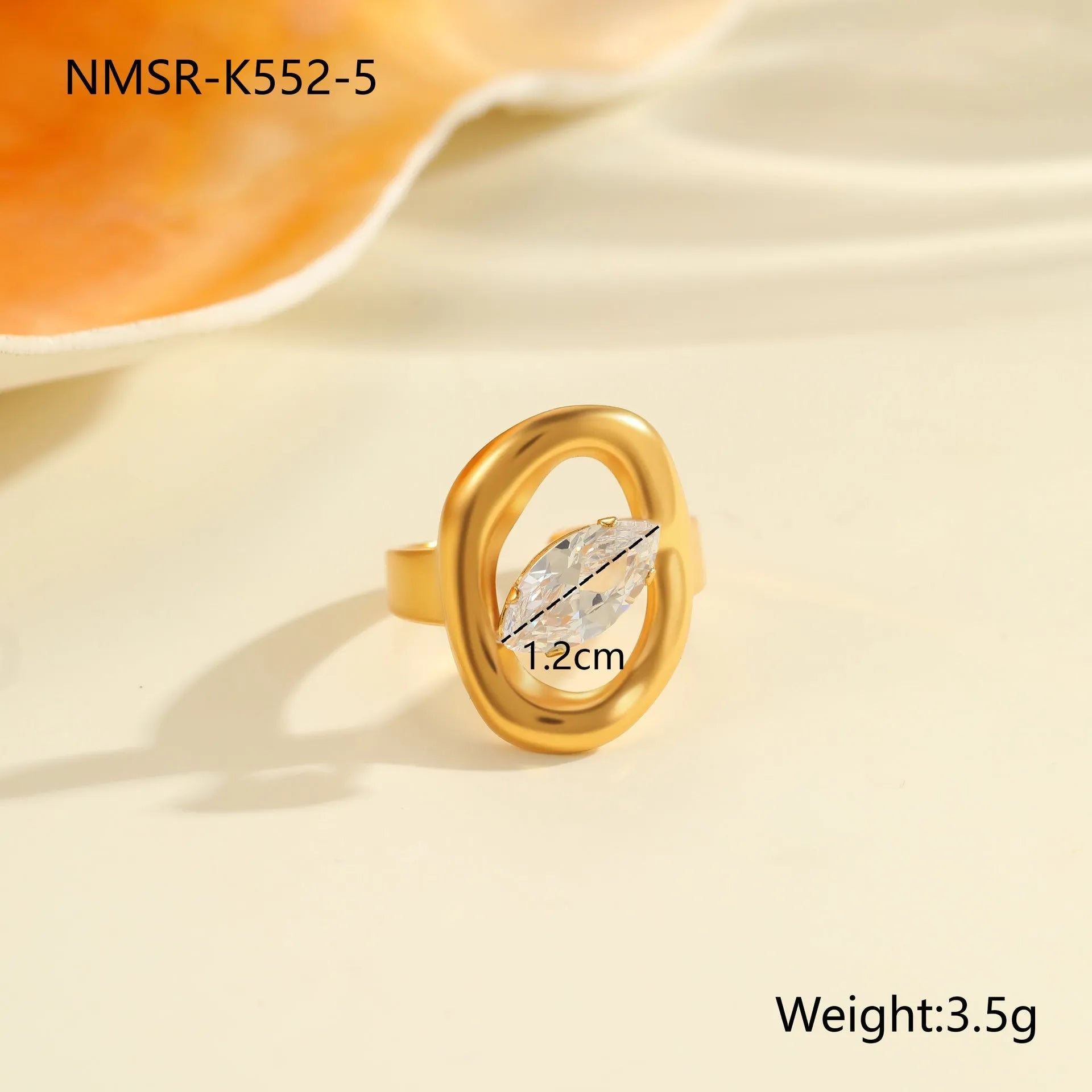 Women's geometric zircon ring with adjustable open mouth design on a hand.