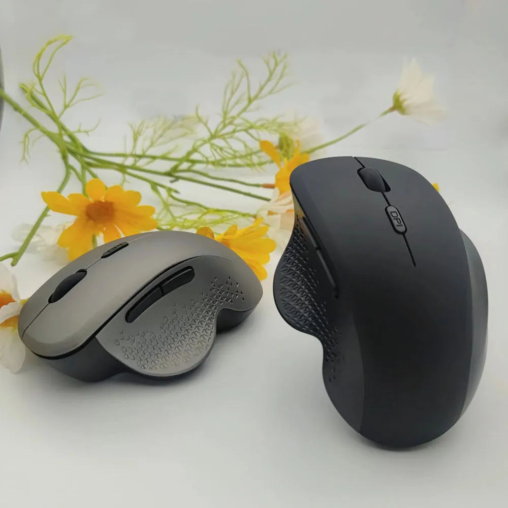 Self-charging wireless mouse for laptops in black or grey with compact design and charging cable