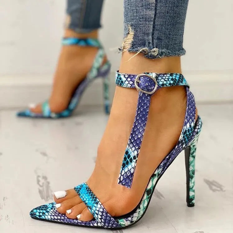 Blue women's high-heeled sandals with serpentine design, buckle fastening, and pointed toe.