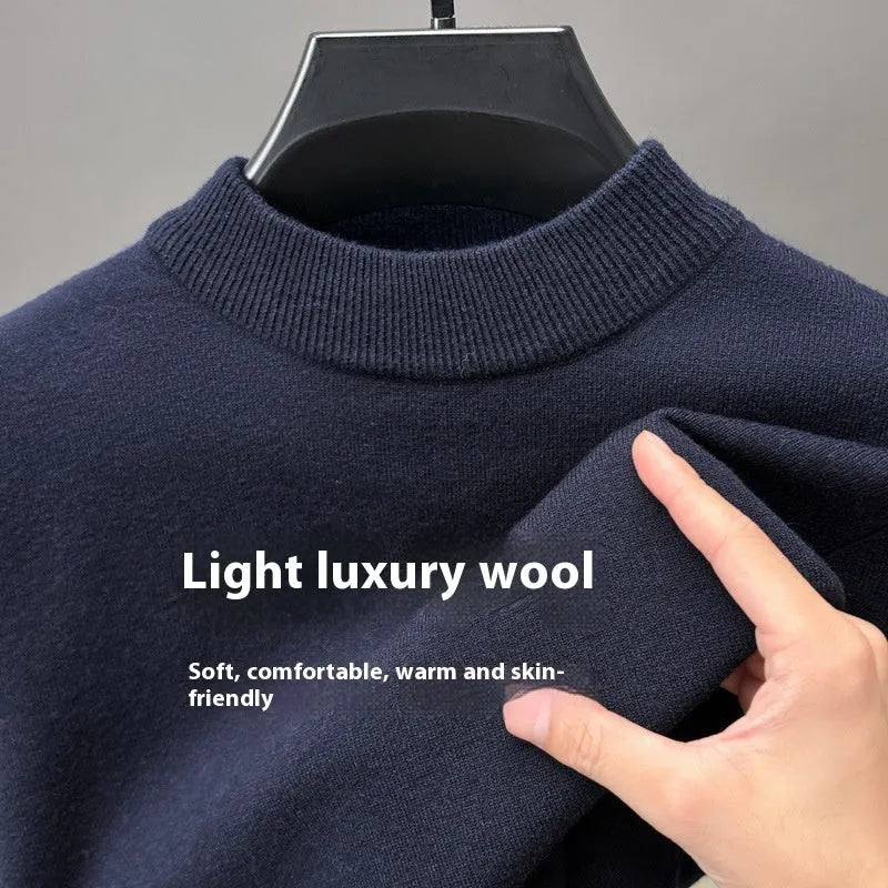 Men's solid colour fine yarn half-turtleneck long sleeve pullover on a hanger.