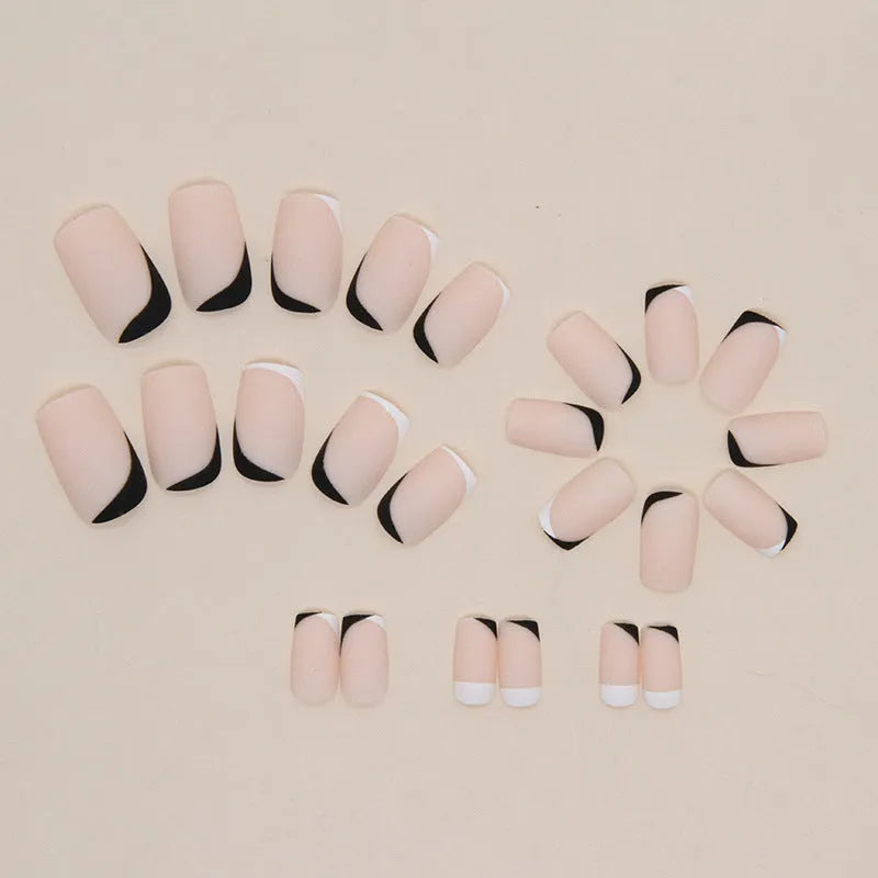W644 black and white frosted matte press-on false nails set on a hand