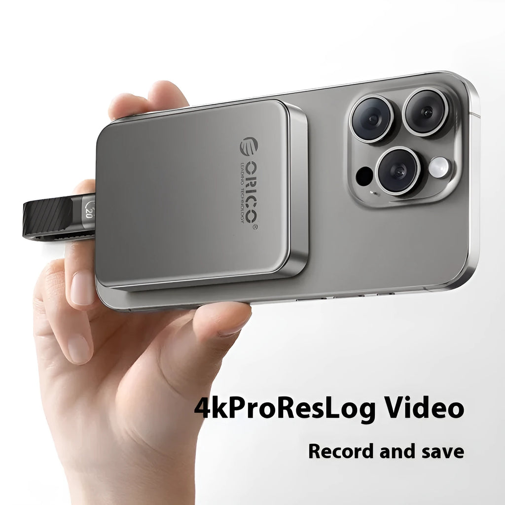 Grey magnetic mobile solid state drive with USB-C cable and magnetic suction ring.