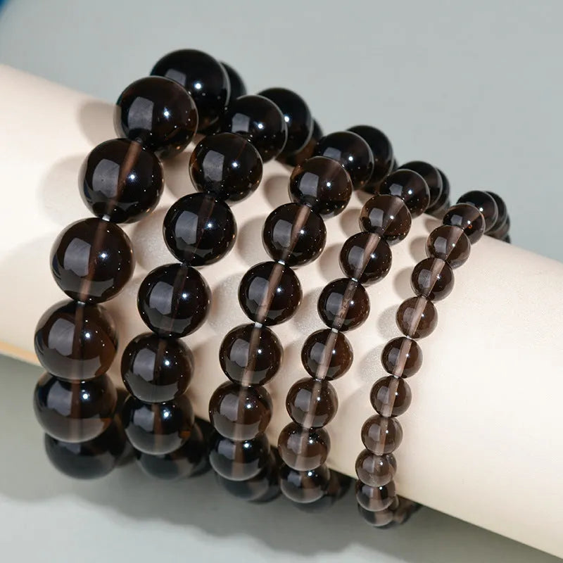 Hand-woven obsidian bracelet with round crystal beads in multiple colour options