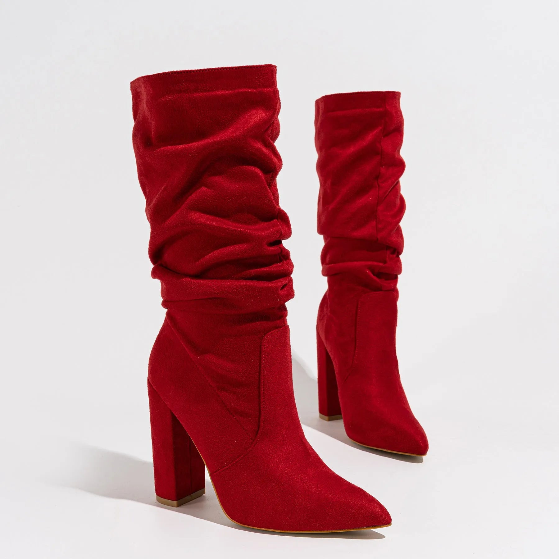 Women's black suede chunky heel pointed-toe mid-calf boots on a white background.
